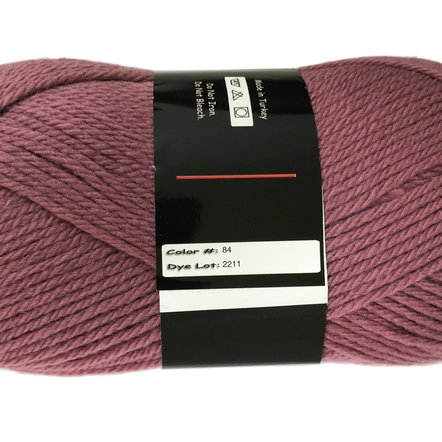 Ball of pink yarn with a label on a white background