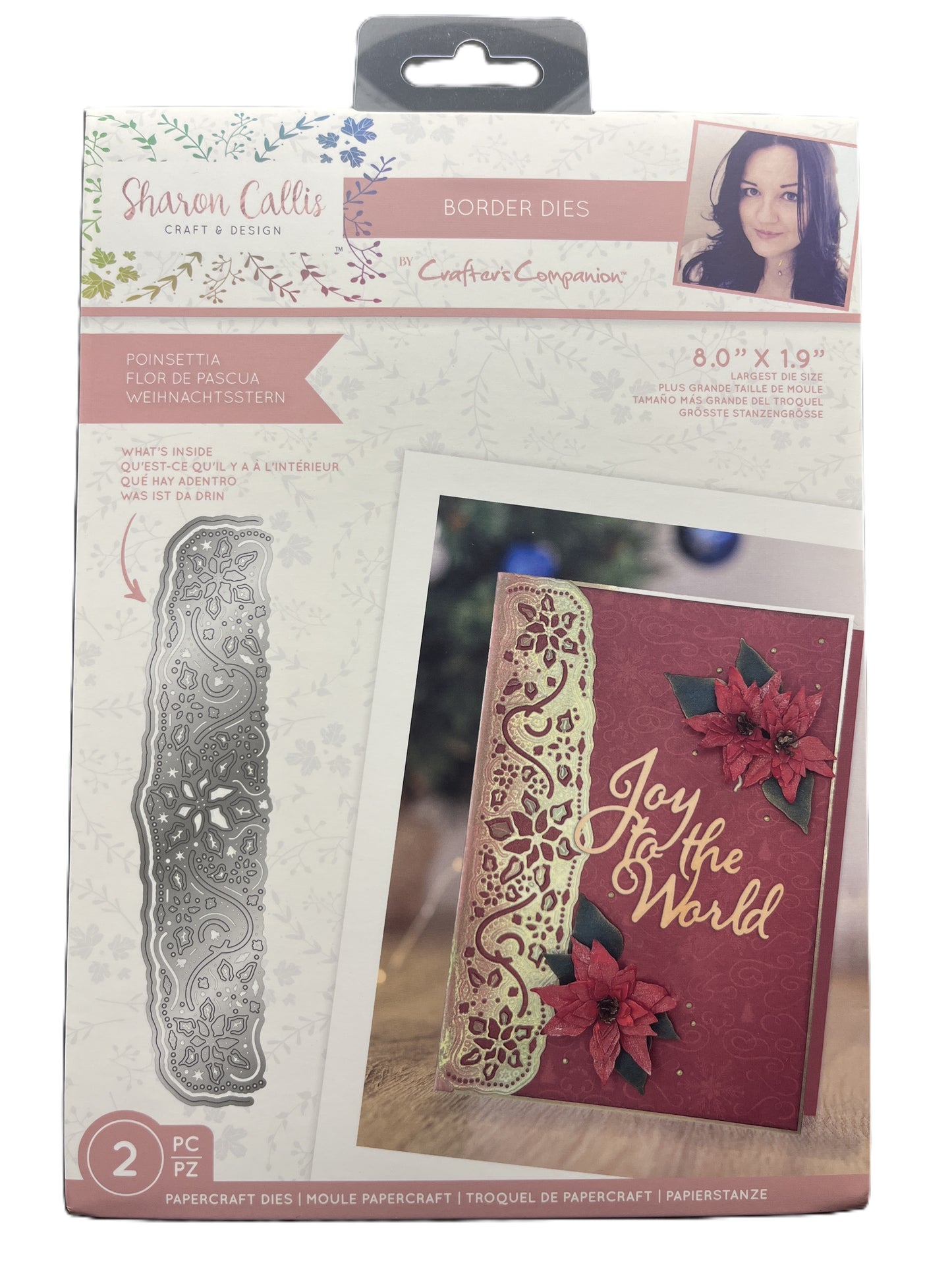 Packaged craft item with metal border die and decorative card on a white background