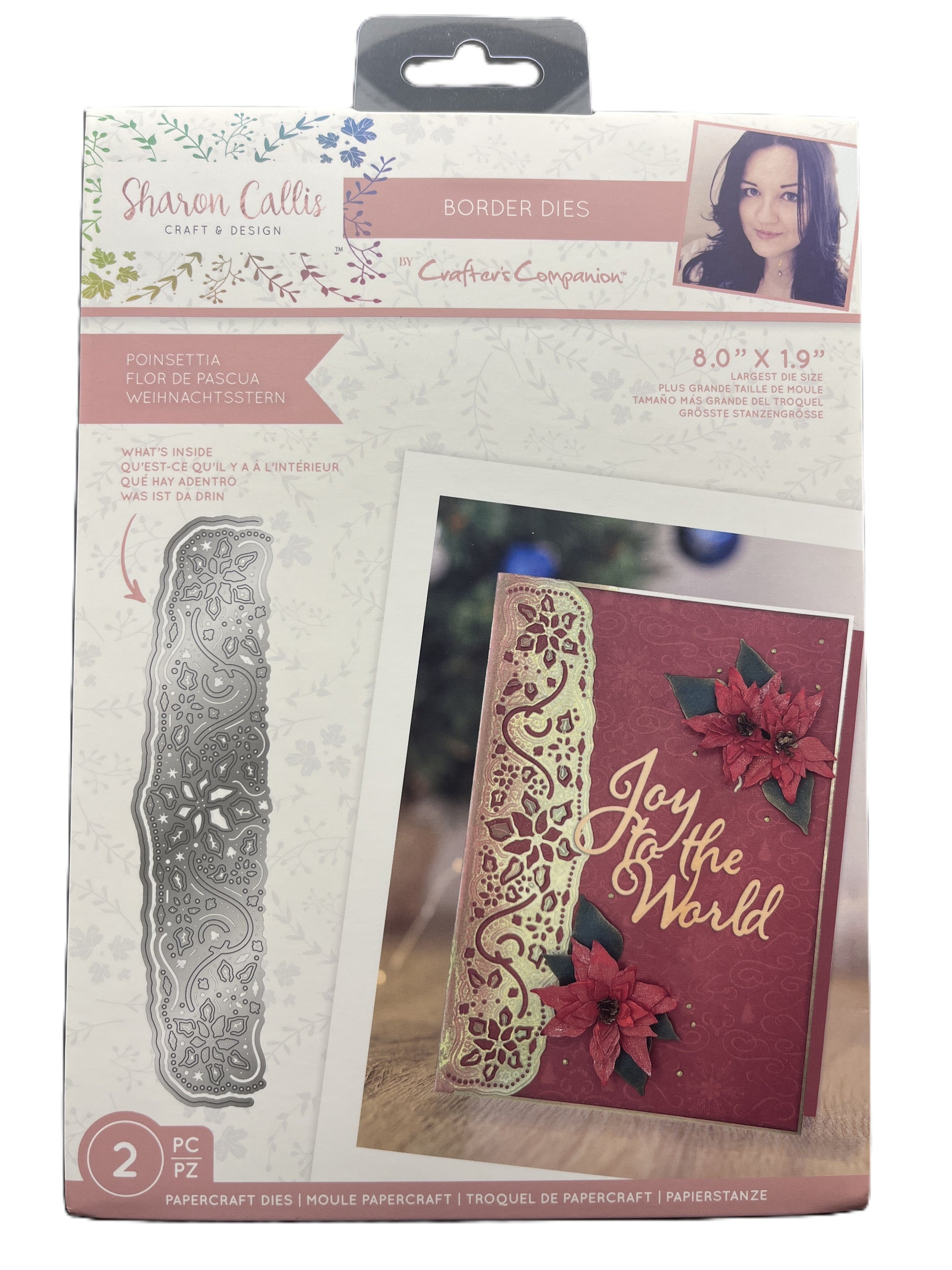 Packaged craft item with metal border die and decorative card on a white background