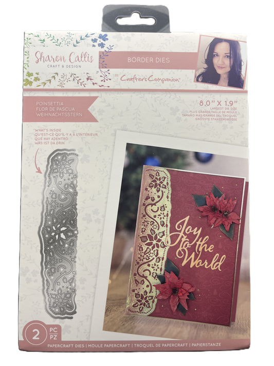 Packaged craft item with metal border die and decorative card on a white background