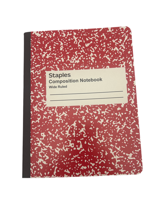 Red composition notebook with speckled pattern on a white background