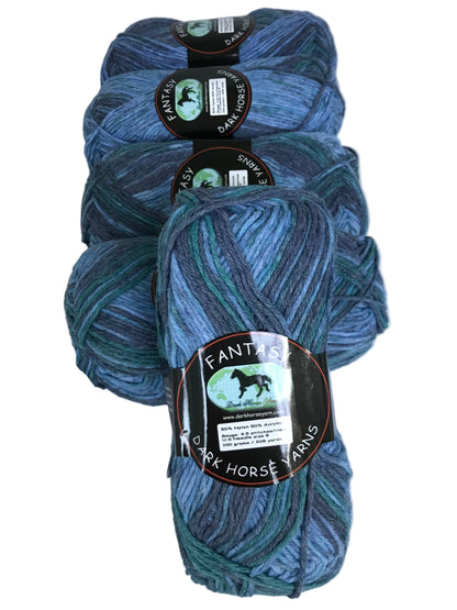 Three skeins of blue yarn with labels on a white background