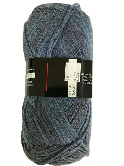 Blue skein of yarn with a label on a white background