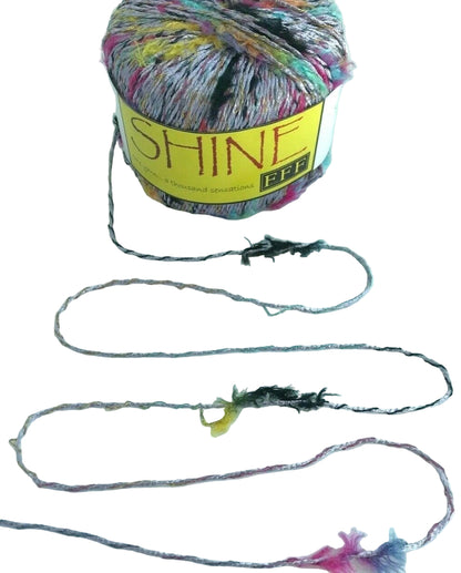 Colorful yarn ball with a string attached on a white background