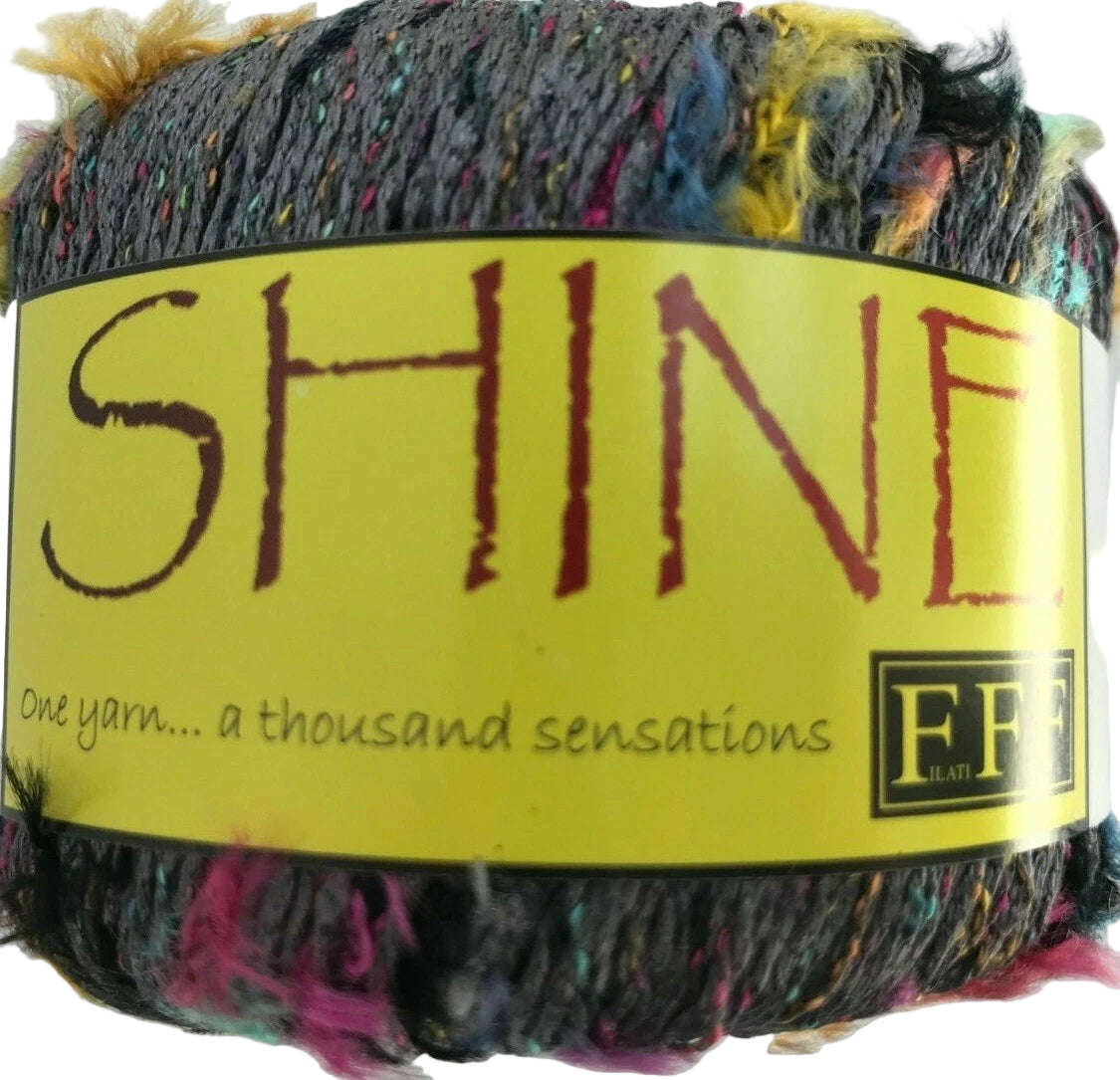 Multicolored yarn with a 'SHINE' label on a white background