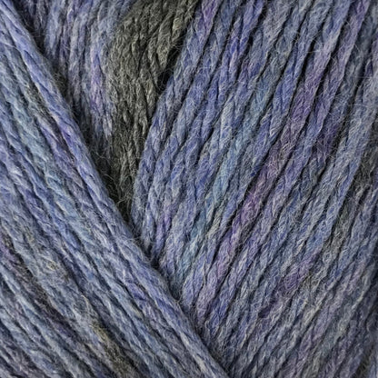 Blue skein of yarn with a label on a beige background