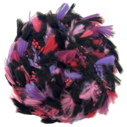 Colorful feathered ball with black, pink, and purple feathers on a white background