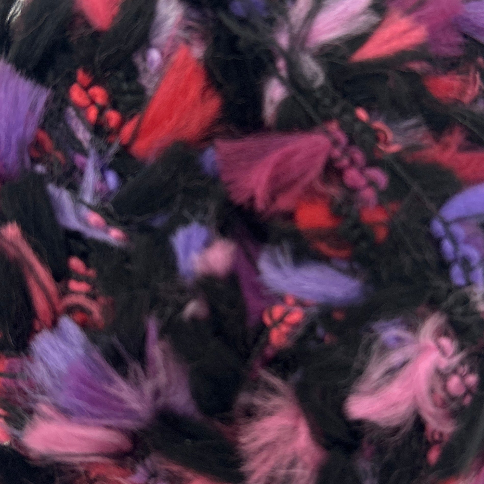 Colorful feathered object on a white background