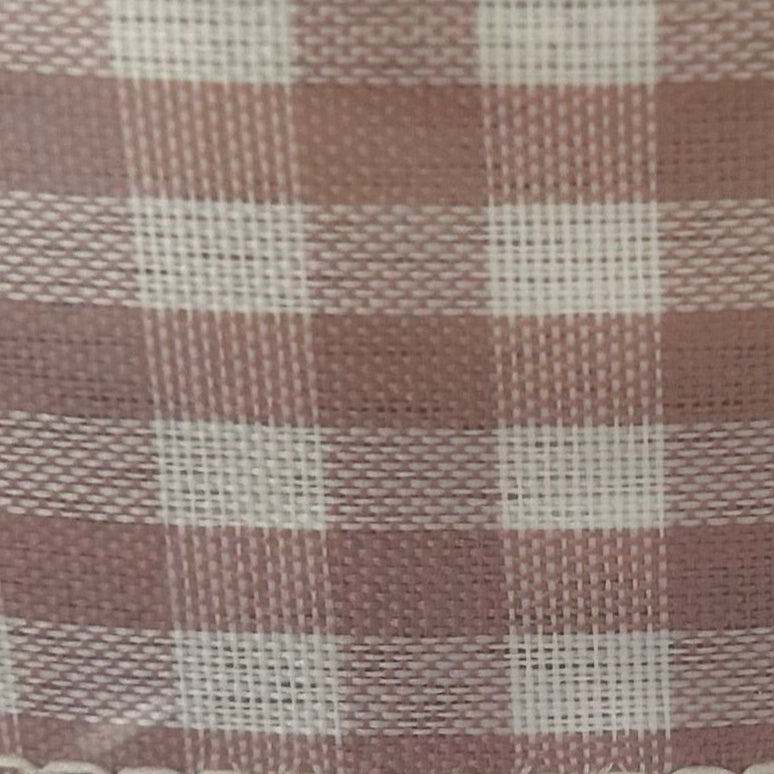 Roll of checkered ribbon with a clear plastic cover on a white background