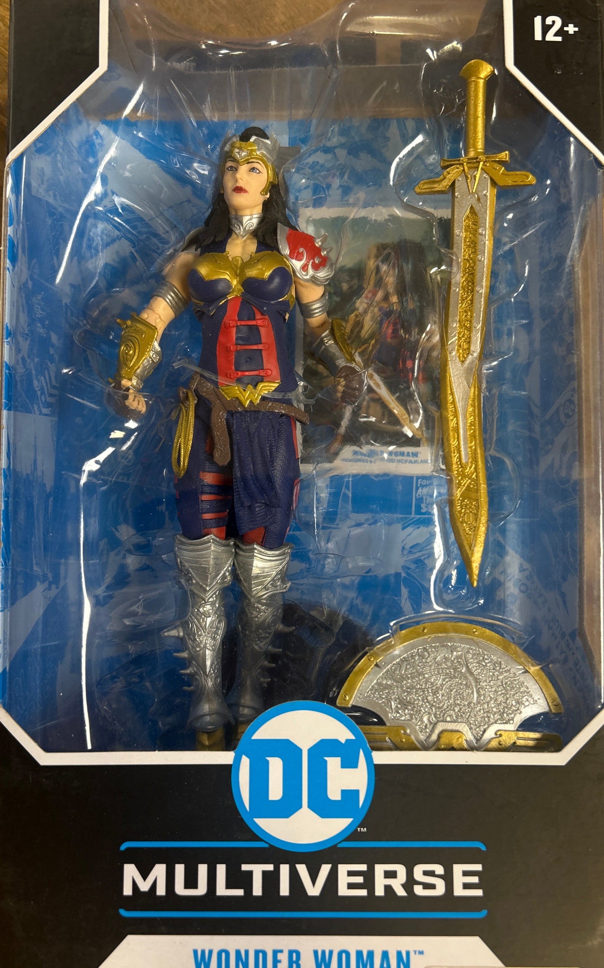 DC Multiverse Wonder Woman action figure in packaging on a wooden surface