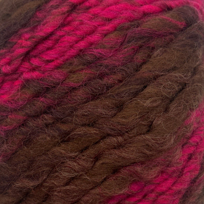 Ball of yarn with brown and pink gradient on a white background