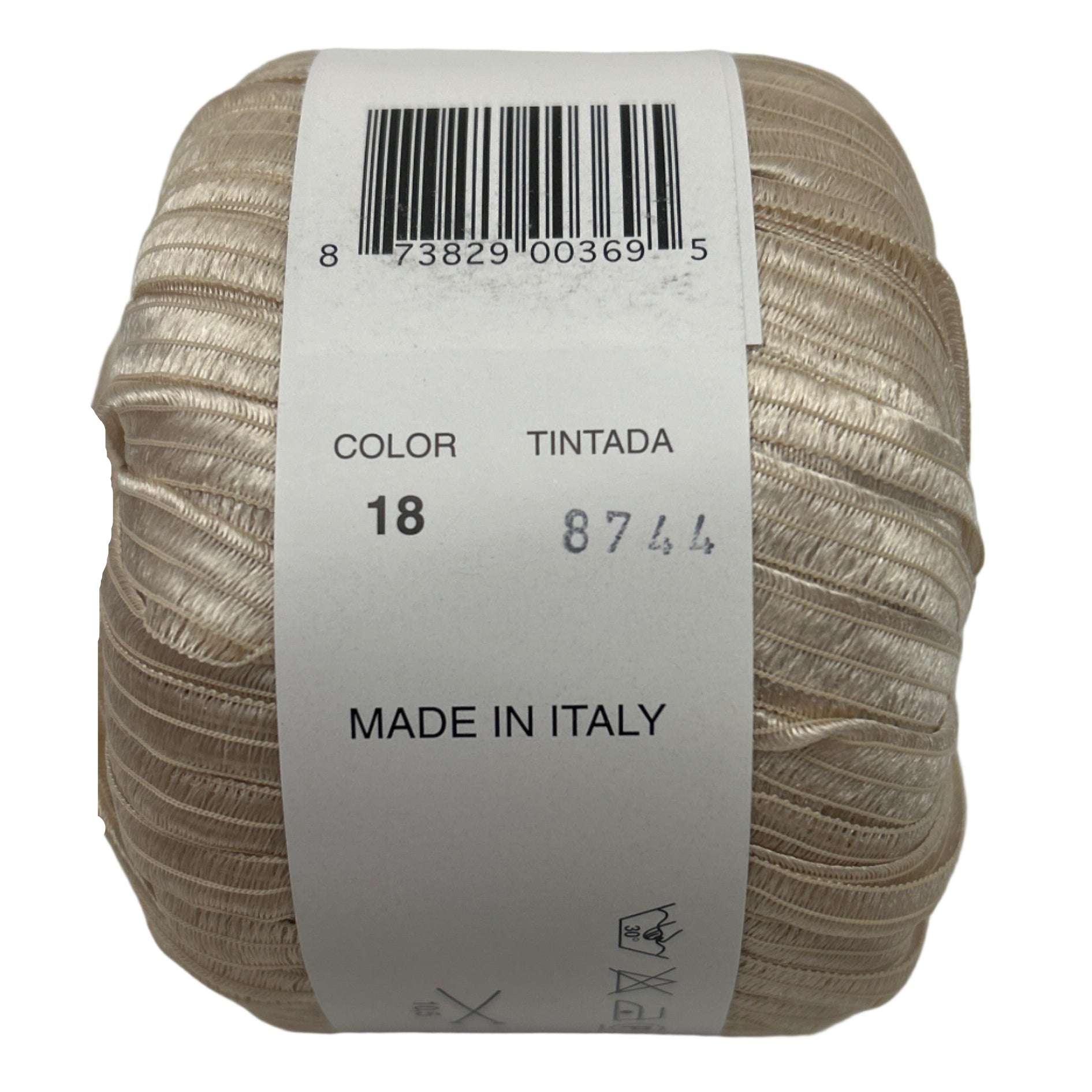 Ball of yarn with a label showing color, brand, and origin on a white background
