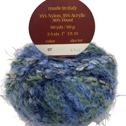 Blue and green yarn ball with a label indicating it is made in Italy and contains 35% nylon, 35% acrylic, and 30% wool.