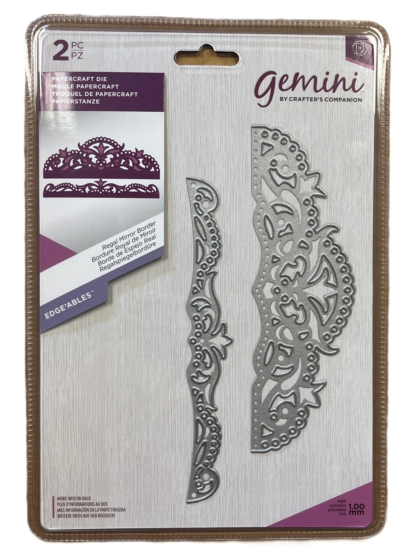 Metallic die set packaging with decorative design on a white background