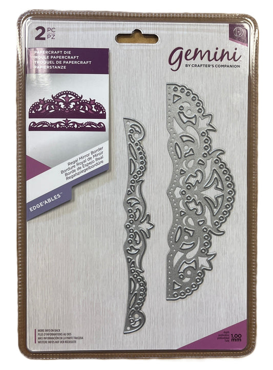 Metallic die set packaging with decorative design on a white background