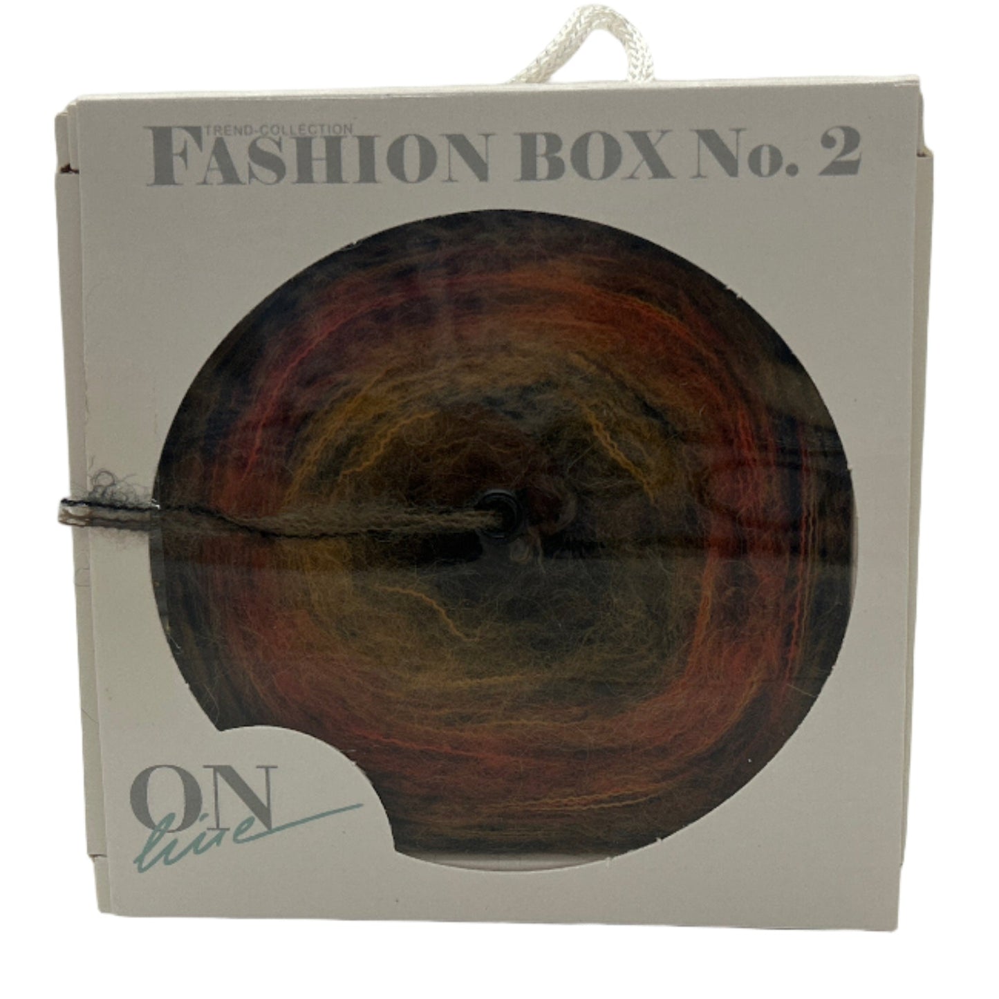 Packaged fashion item with 'Fashion Box No. 2' text on a white background