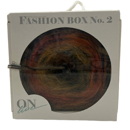 Packaged fashion item with 'Fashion Box No. 2' text on a white background