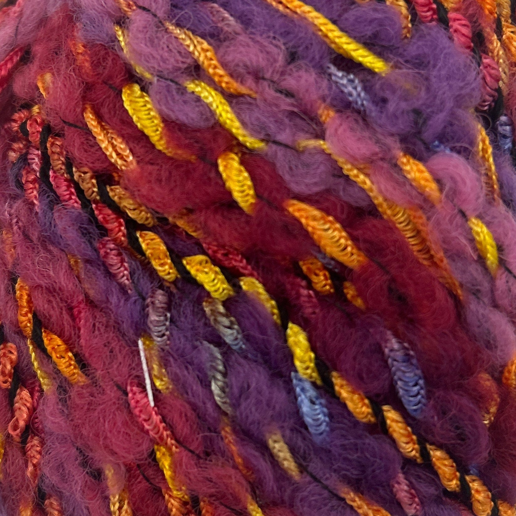 Multicolored skein of yarn on a white background