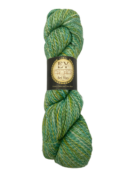 Green and yellow skein of yarn with a label on a white background