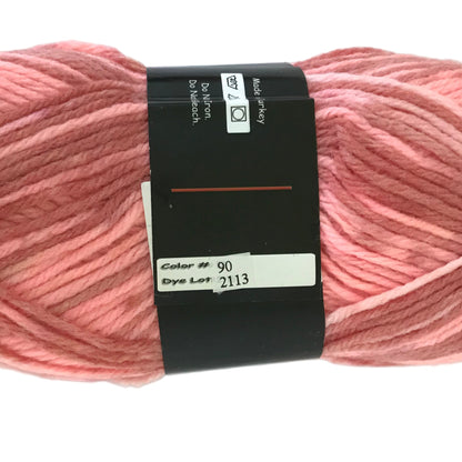 Ball of pink yarn with a label on a white background