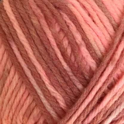 Ball of pink yarn on a white background