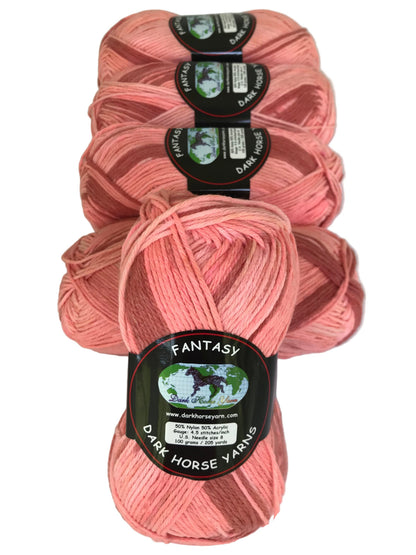 Pink yarn skeins with 'Fantasy' label on a white background