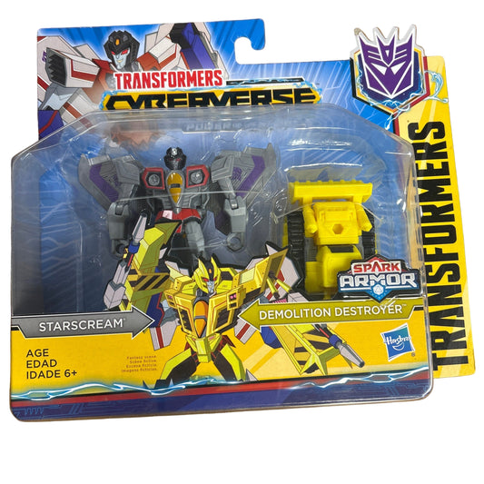 Transformers Cyberverse action figures in packaging on a wooden surface