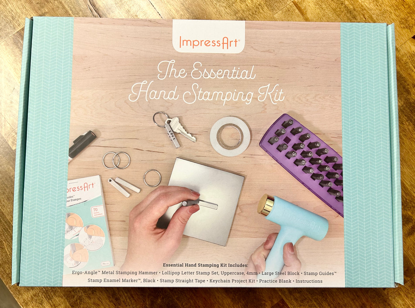 ImpressArt hand stamping kit packaging on a wooden surface