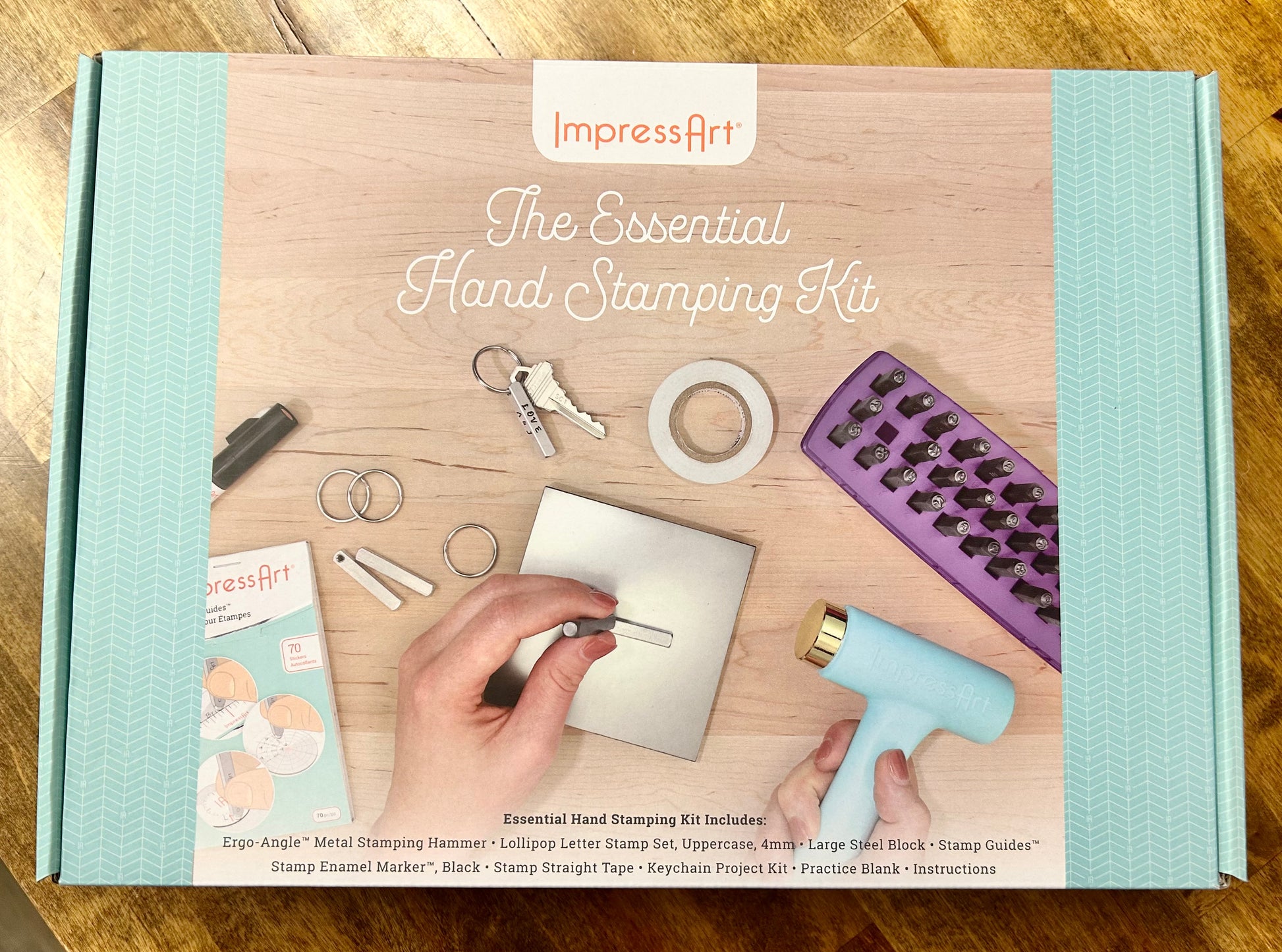 ImpressArt hand stamping kit packaging on a wooden surface