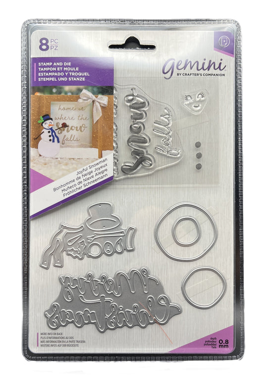 Packaged Gemini metal stamps and dies with decorative text and snowman design on a white background