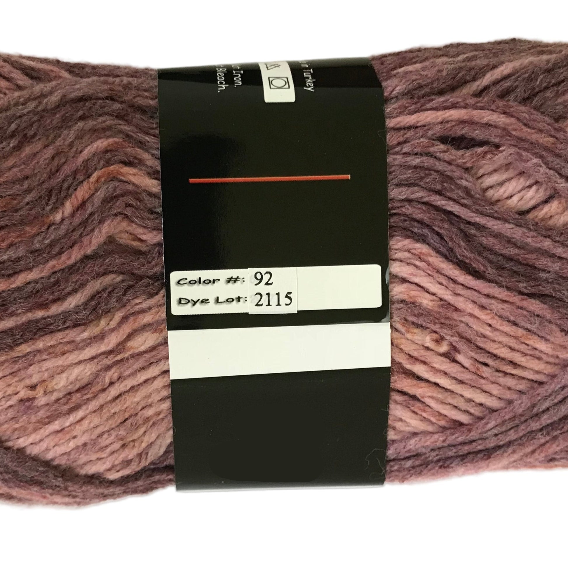 Ball of yarn with a label showing color number 92 and dye lot 2115 on a white background