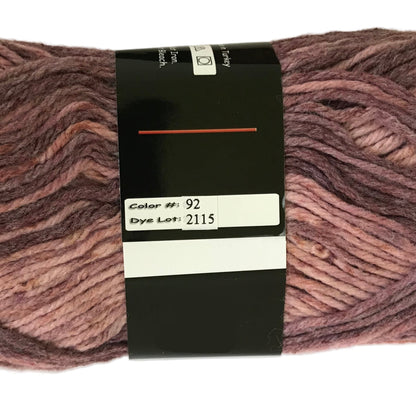 Ball of yarn with a label showing color number 92 and dye lot 2115 on a white background