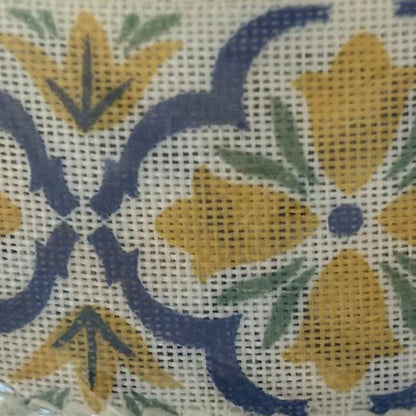Floral pattern with yellow flowers and blue leaves on a white background