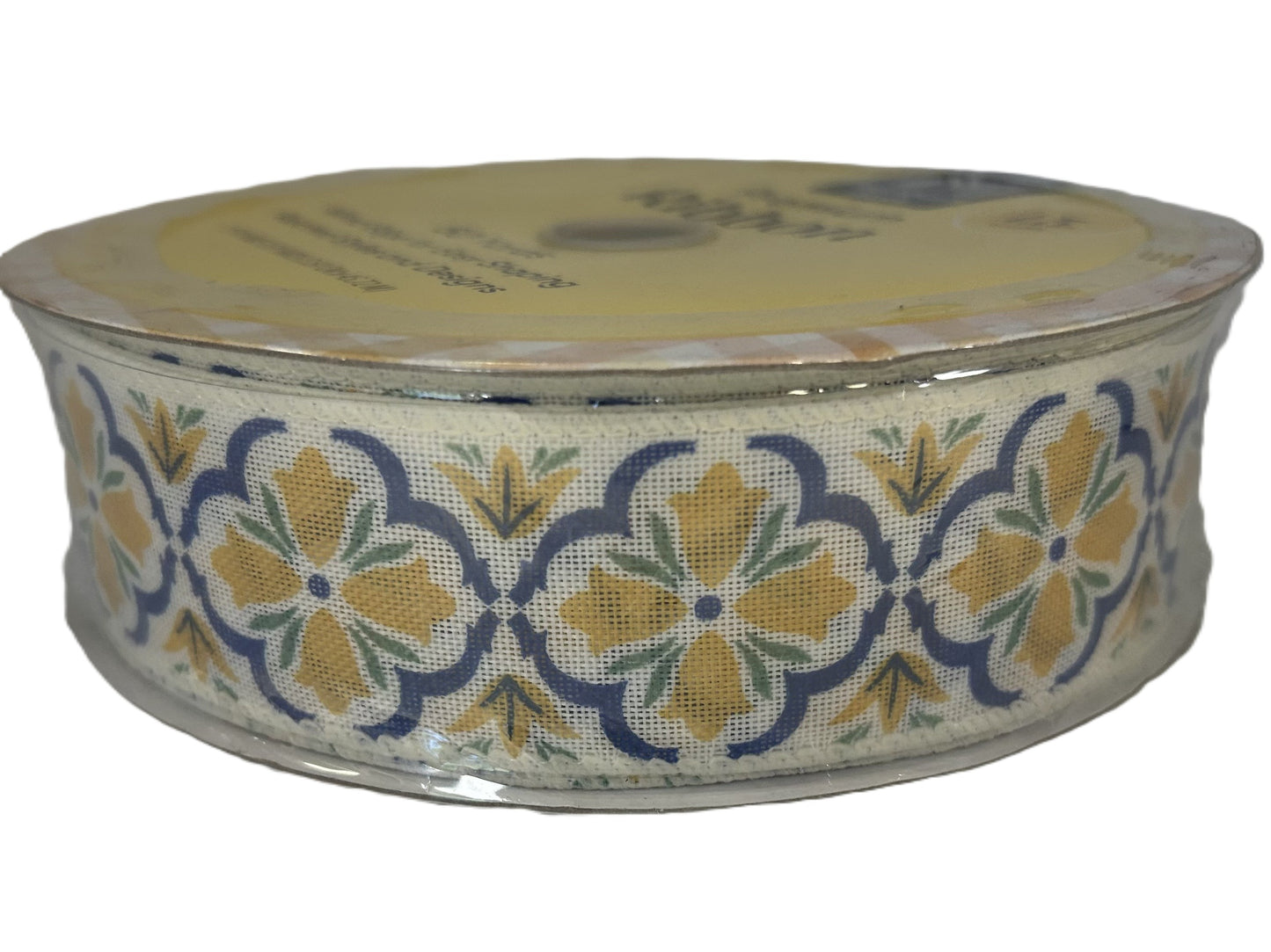 Roll of floral-patterned ribbon on a white background