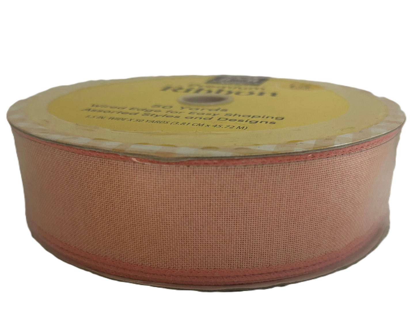 Roll of pink ribbon with a label on a white background