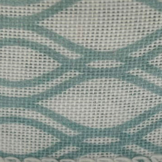 Close-up of a textured fabric with wavy pattern in teal and gray.