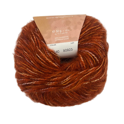 Brown yarn ball with a label on a white background