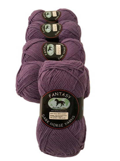 Four skeins of purple yarn with labels on a light background