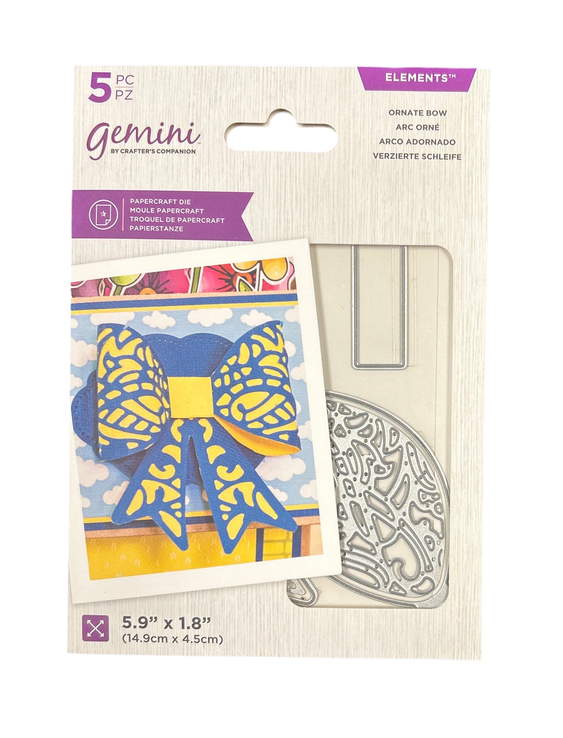 Packaging of Gemini paper craft die with decorative bow design on a white background