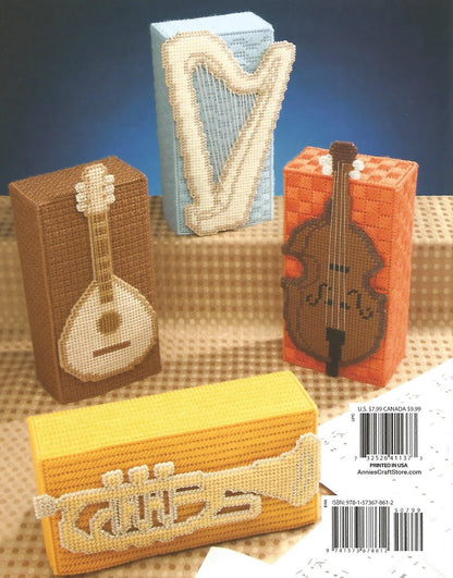 Decorative boxes with musical instrument designs on a textured surface.
