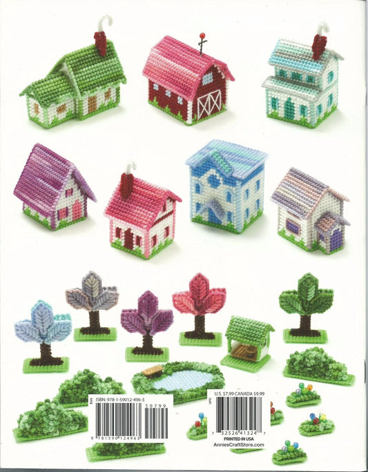 Set of small model houses and trees on a white background