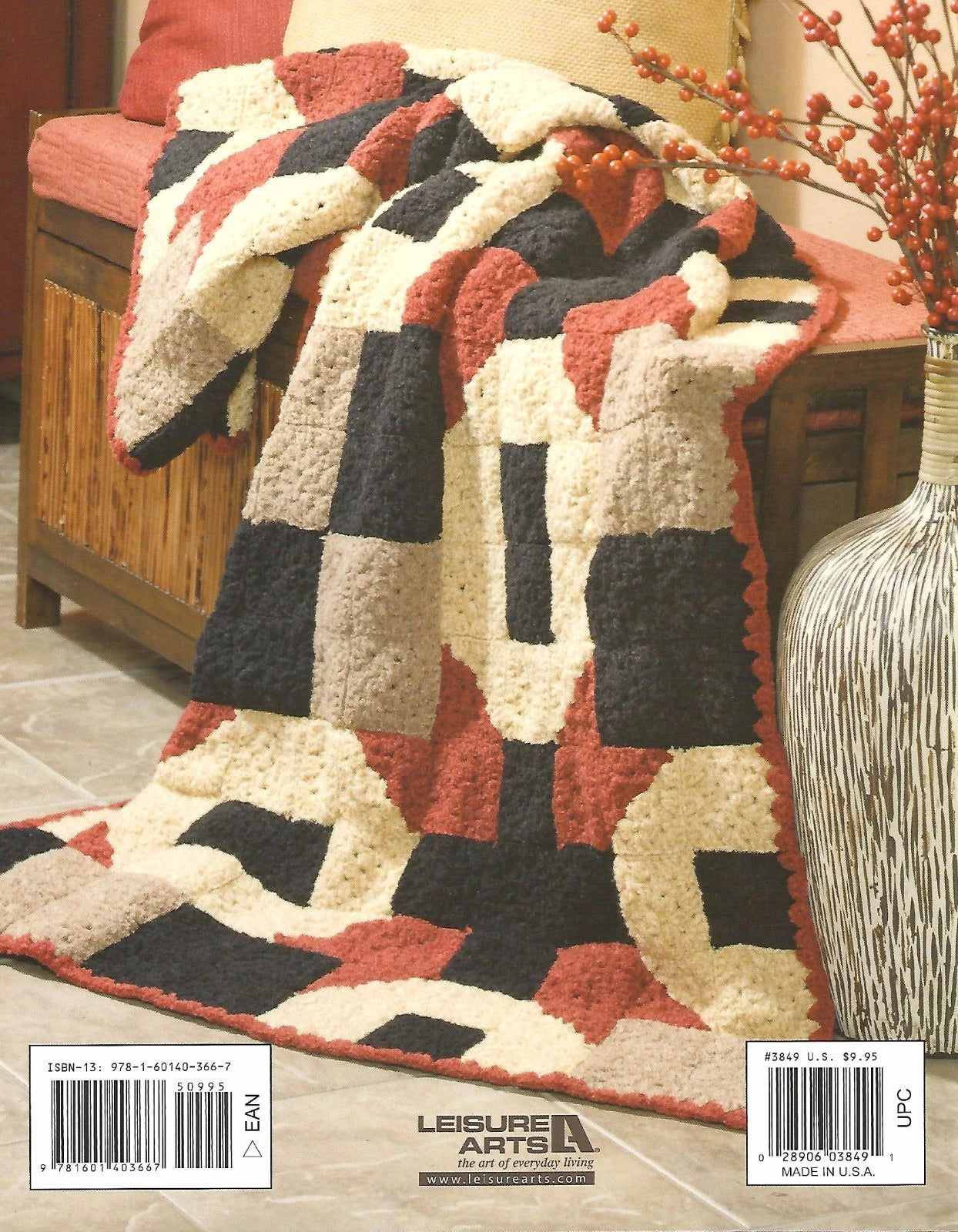 Textured area rug with geometric pattern on a wooden floor, featuring Leisure Arts branding.