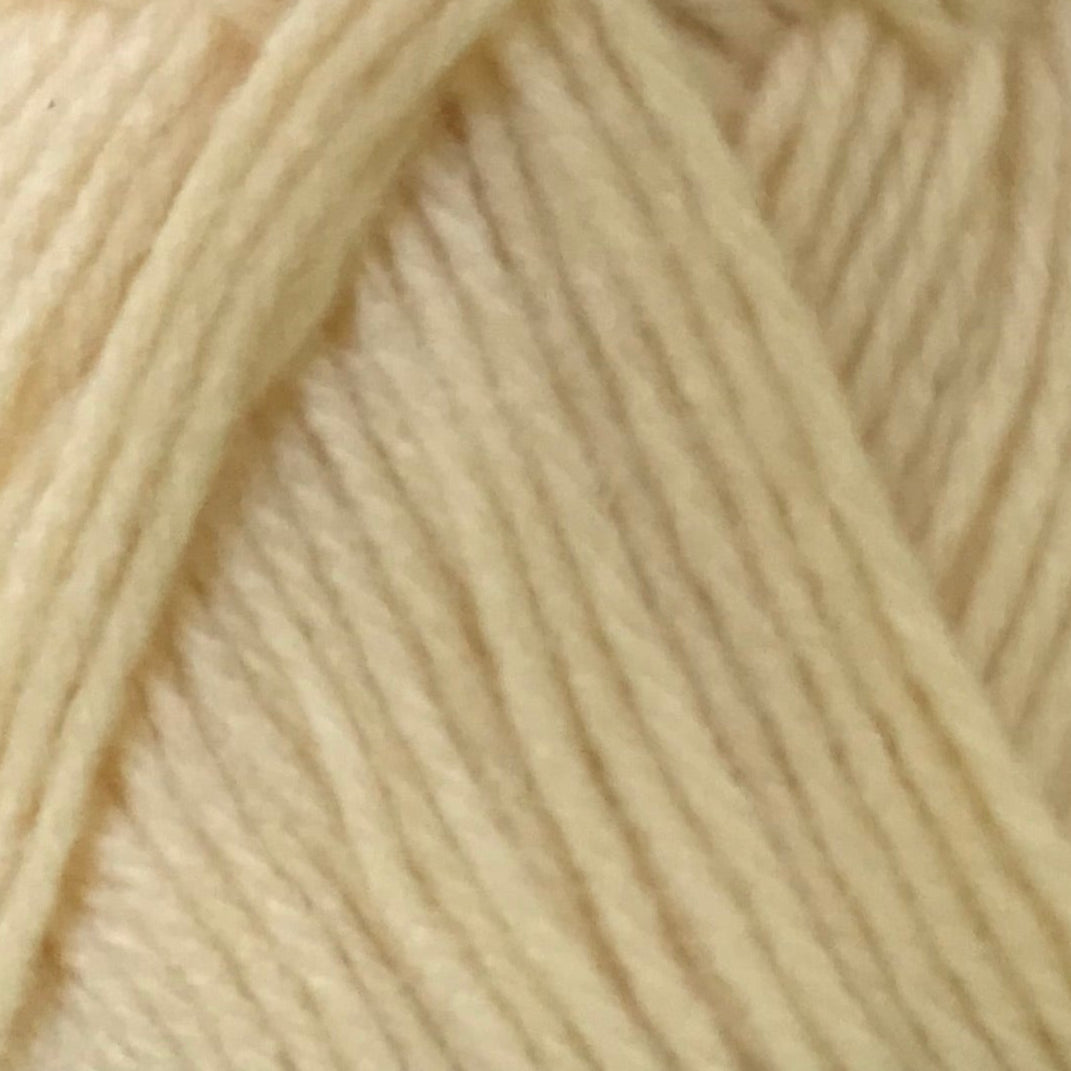 Close-up of beige yarn with a soft texture