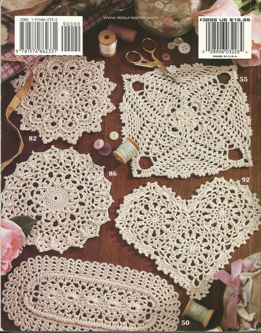 Collection of crocheted doilies on a wooden surface with sewing tools.