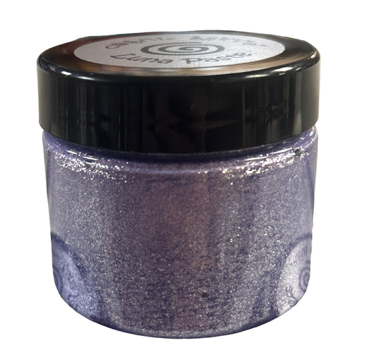 Jar of glitter with a black lid on a reflective surface