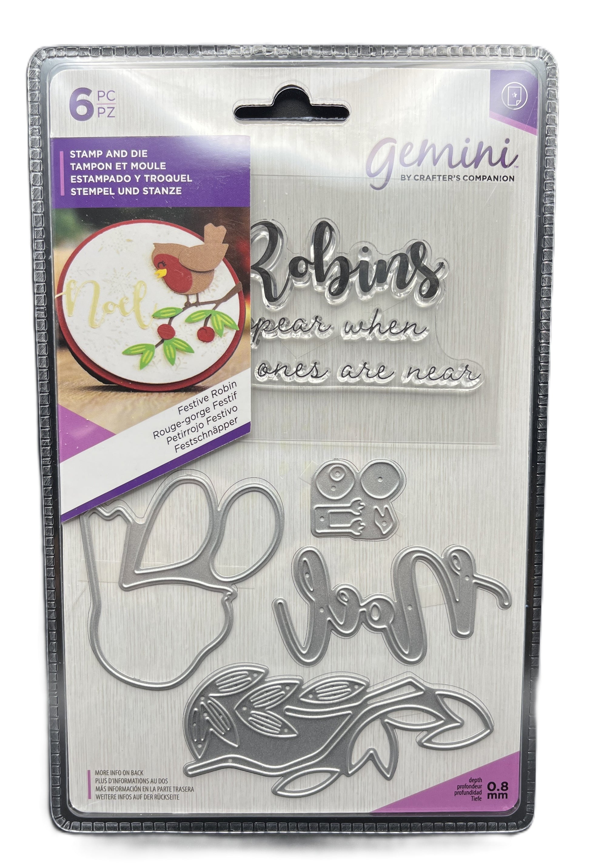 Packaged Gemini metal stamps with decorative text and illustrations on a white background
