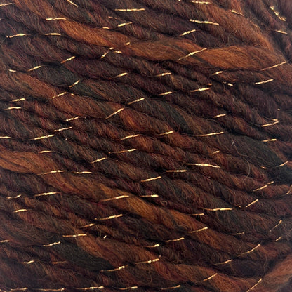 Brown yarn ball with gold threads on a white background