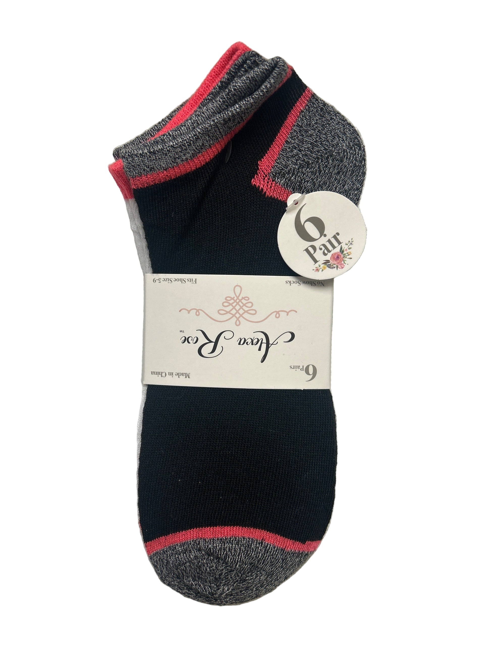 Pair of black socks with gray accents on a textured surface