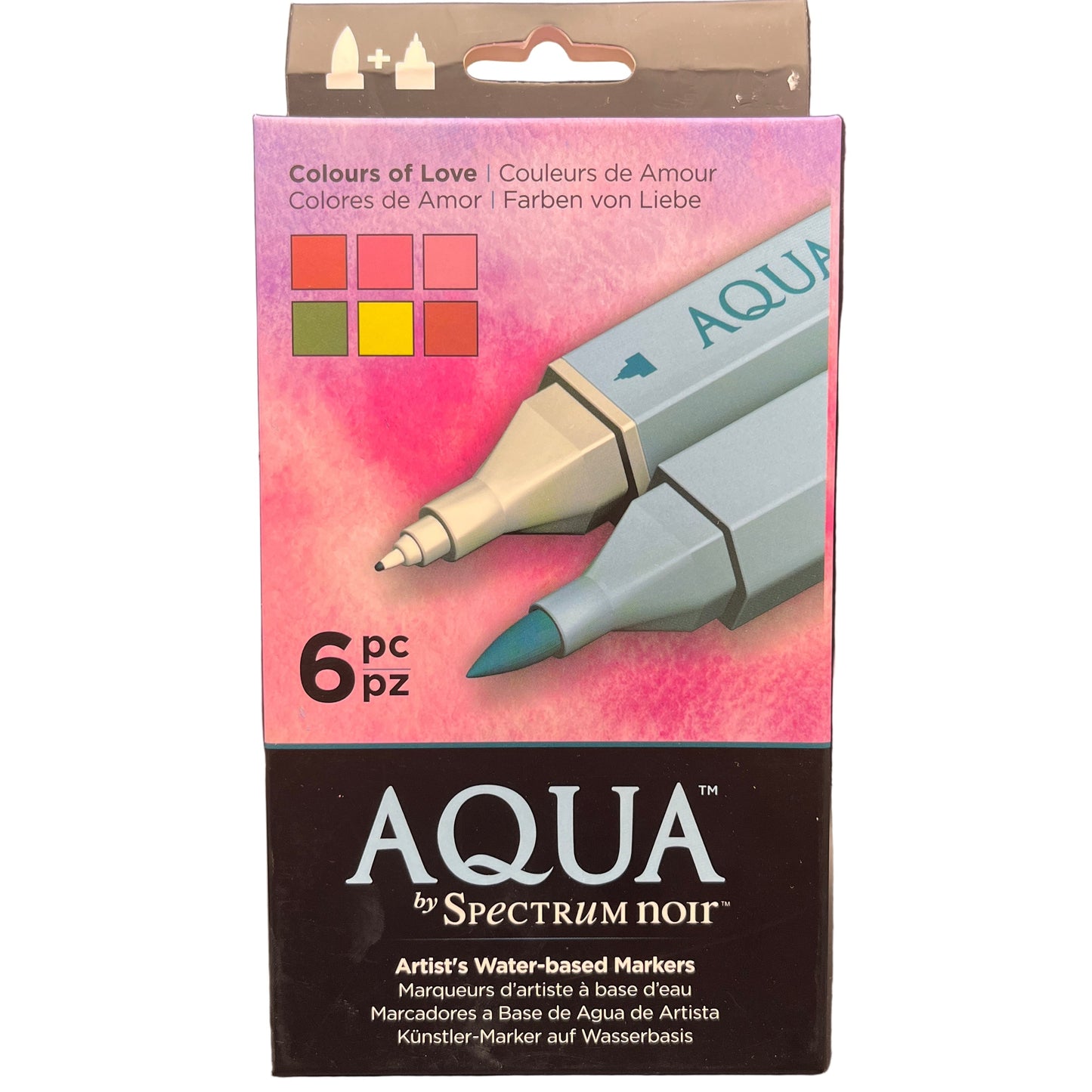 Packaging of Aqua by Spectrum Noir water-based markers with a pink watercolor design on a white background.