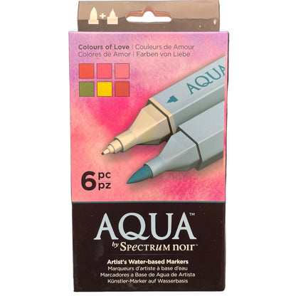 Packaging of Aqua by Spectrum Noir water-based markers with a pink watercolor design on a white background.